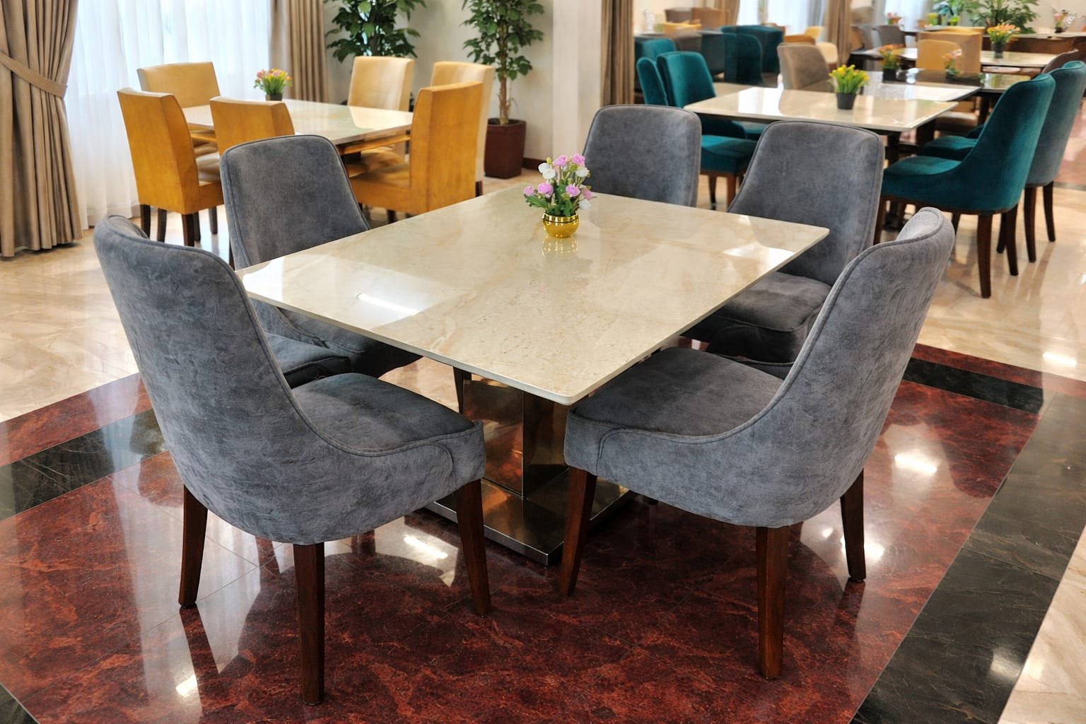 white marble top with grey chairs